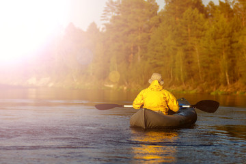 Man Kayaker on the Lake. Kayak Paddling. Water Sport and Recreation.