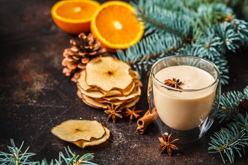 Christmas eggnog in a glass in Christmas background, copy space.
