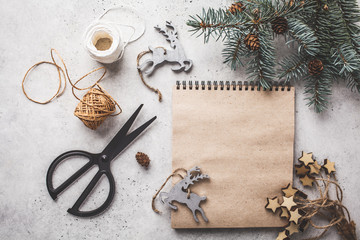 Christmas background with Christmas tree and notepad. Christmas flat lay.
