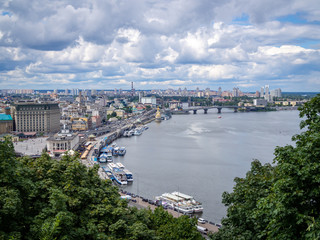 Fototapeta na wymiar Observation desk aerial view of the Dnieper river in the centre of Kiev, Ukraine, cloudy dramatic sky