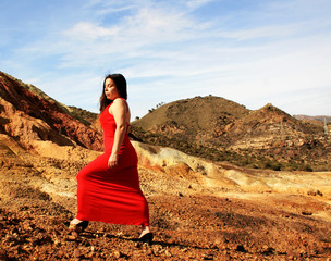 RED DRESSED WOMAN IN DESERT