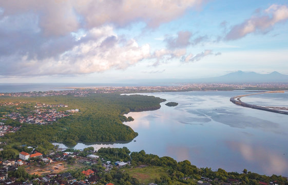 Aerial view of a scenic coastline on a cloudy day in Uluwatu, south of Bali island of Indonesia.