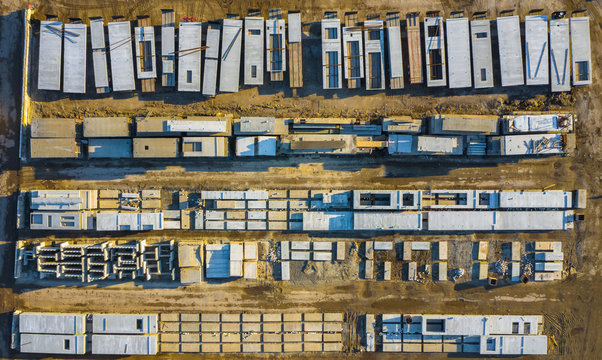 Aerial view of finished concrete slabs and related products at a concrete manufacturing facility in the afternoon sun in Aurora, IL, USA