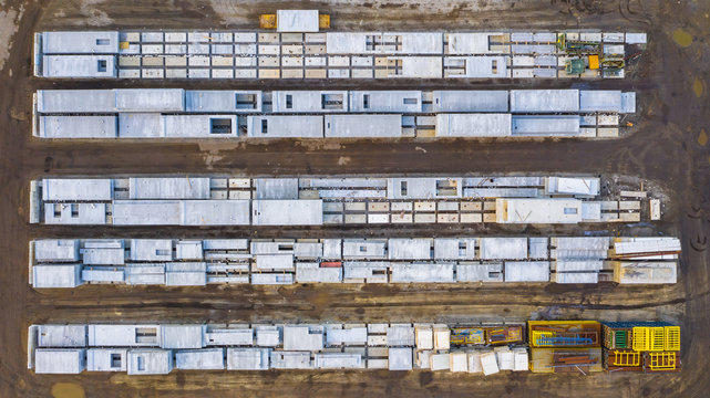 Aerial view of finished concrete slabs and related products at a concrete manufacturing facility in the afternoon sun in Aurora, IL, USA