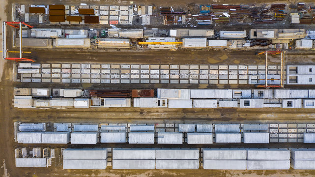 Aerial view of finished concrete slabs and related products at a concrete manufacturing facility in the afternoon sun in Aurora, IL, USA