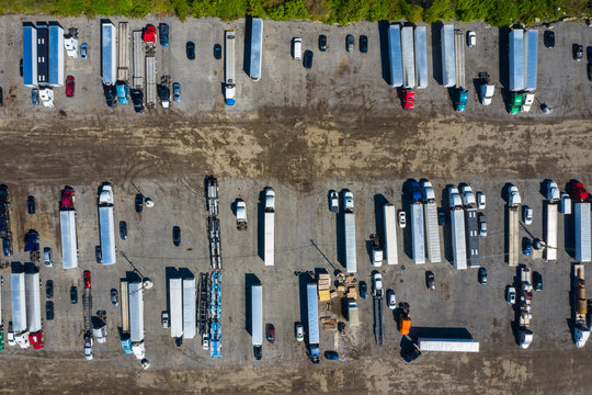 Aerial view of parked semi trucks and cars at a parking lot in Romeoville, IL - USA