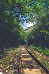mountain landscape, the old railway passes through the gorge in the mountains