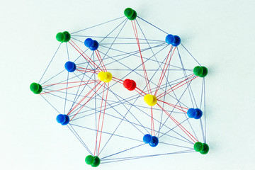 The colored needles are interconnected by a thread, the concept of interaction with each other, and...