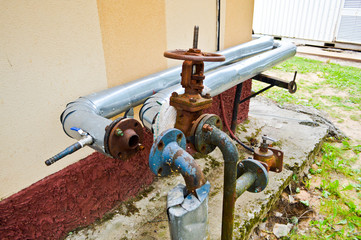 Iron old rusty corrosion-proof industrial metal pipes with flanges valves transitions and branches...