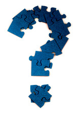 Puzzle in the shape of a question mark on a white isolated background