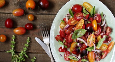  cherry tomatoes salad of different colors and basil. bright summer salad. 