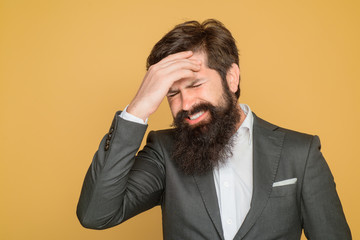 Migraine, stress, headache, frustration concept. Bearded man suffering from severe headache. Helpless face expression. Stressed businessman has strong headache. Frustrated business man with headache.