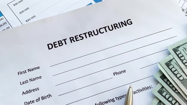 Debt restructuring document with graph on table.