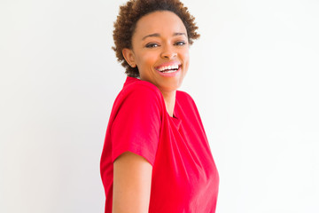 Beautiful young african american woman smiling confident to the camera showing teeth over isolated white background