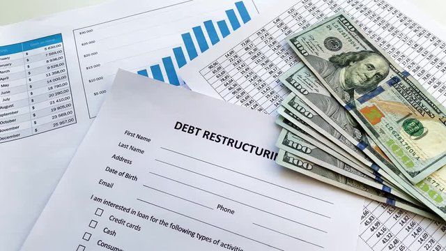 Debt restructuring document with graph on table.