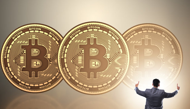 Businessman walking towards bitcoins in cryptocurrency blockchai