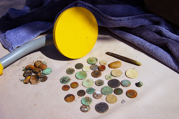 The photo of gold and silver  coins collected with help of underwater metal detector. Treasure...