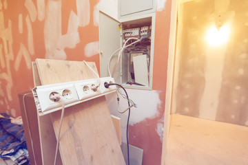Temporary electrical outlets for constructions tools and gears is connected up electrical box in...