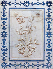 Bas-relief with marble flower at facade of Palase in Amer fort, Jaipur, Rajasthan, India