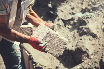 The builder is building a wall