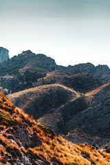 Contrast hill mountain panorama views with dry summer nature on a bright travel exploring and hiking day. Cap de Formentor, Serra de Tramuntana, Mallorca, Spain , Balearic Islands