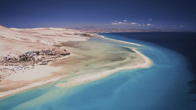 Aerial drone camera footage captured while flying over the Sotavento beach lagoon in Fuerteventura island.