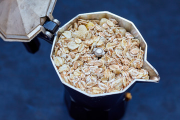 Oat-flakes, coffee on blue background. Cereals.