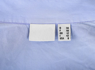 40 size clothes label on blue background closeup