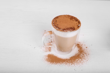 Close up of latte cinnamon sprinkle on white background