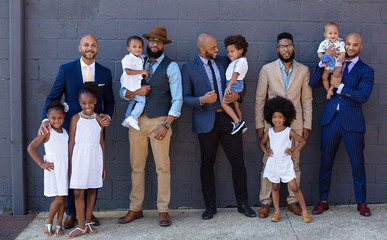 Portrait of fathers and children in formal clothes