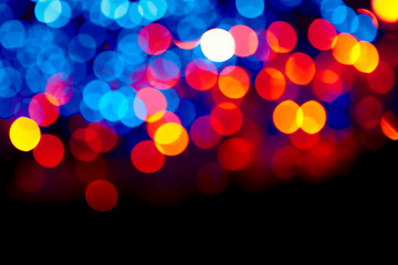 Colorful circles bokeh festive glitter dark background. Holiday greeting cards, invitations, flyers, blog posts, banners design.