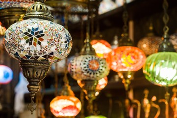  lanterns at the bazaar. Colorful background. Traditional stained glass lamps in street market 