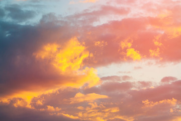Beautiful orange and yellow evening dark cloudscape at sunset. Sundown skyscape background....