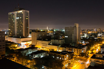 Fototapeta na wymiar Nightscape view of the neighborhood of Vedado. Top view of the streets and buildings of Havana (Cuba). 