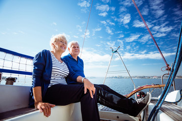 Couple relaxing in sailboat during summer vacation