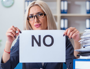 Businesswoman with message in office at desk