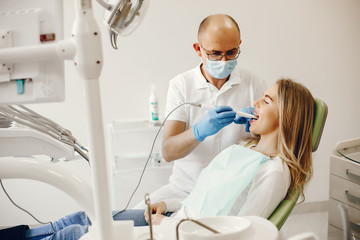 Beautiful lady in the dentist's office. Woman in a uniform