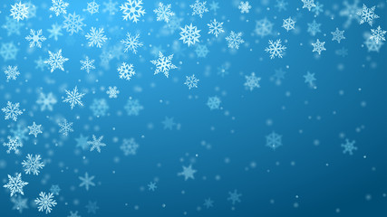 Fototapeta na wymiar Christmas background of complex blurred and clear falling snowflakes in light blue colors with bokeh effect