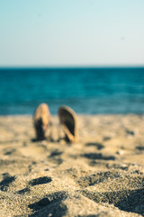 summer background with flip flops on a sandy beach - 278636214