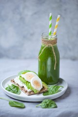 smoothie . Dietary breakfast, spinach smoothie and avocado sandwich with egg