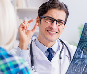 Doctor examining x-ray images of patient
