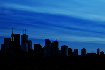 Toronto skyline silhouette with deep blue sky