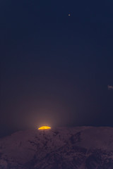 A nice planetary conjunction over the night sky. Jupiter, top right, and the Moon, low left, rising...