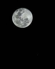 An amazing astronomy event, Saturn covered by the Moon surface awe night sky view from Santiago,...
