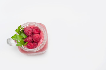 smoothies with raspberries on white background