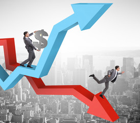 Businessman with charts of growth and decline