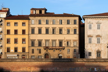 Palazzo Grassi facade elevation in the evening sun in Pisa, Italy