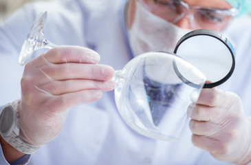 Forensics investigator working in lab on crime evidence