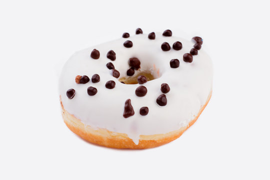 Delicious fresh donut on white background. Tasty snack with icing.