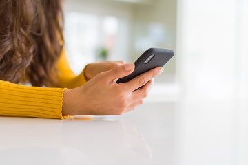 Close up of woman hands using smartphone